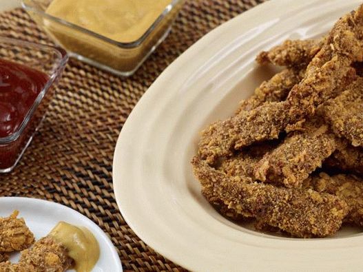 Photo de bâtonnets de poulet croustillants cuits au four